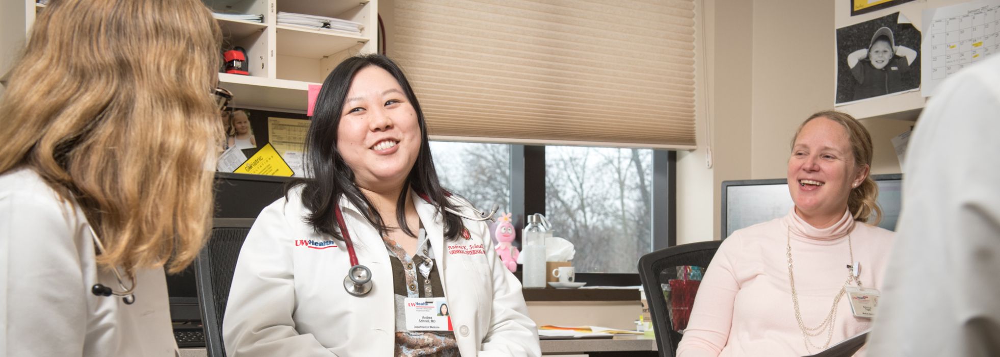 Dr. Andrea Schnell and colleagues talk in the clinic office