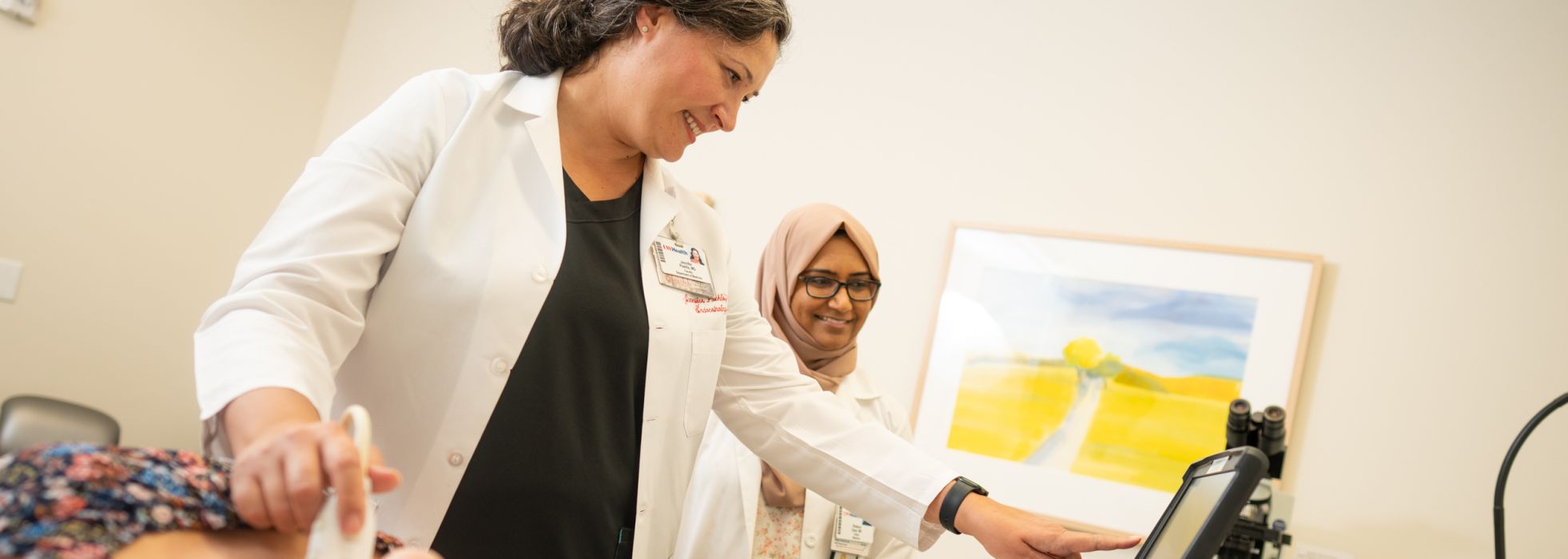 Doctors Jennifer Poehls, and Shakera Syed performing an ultrasound