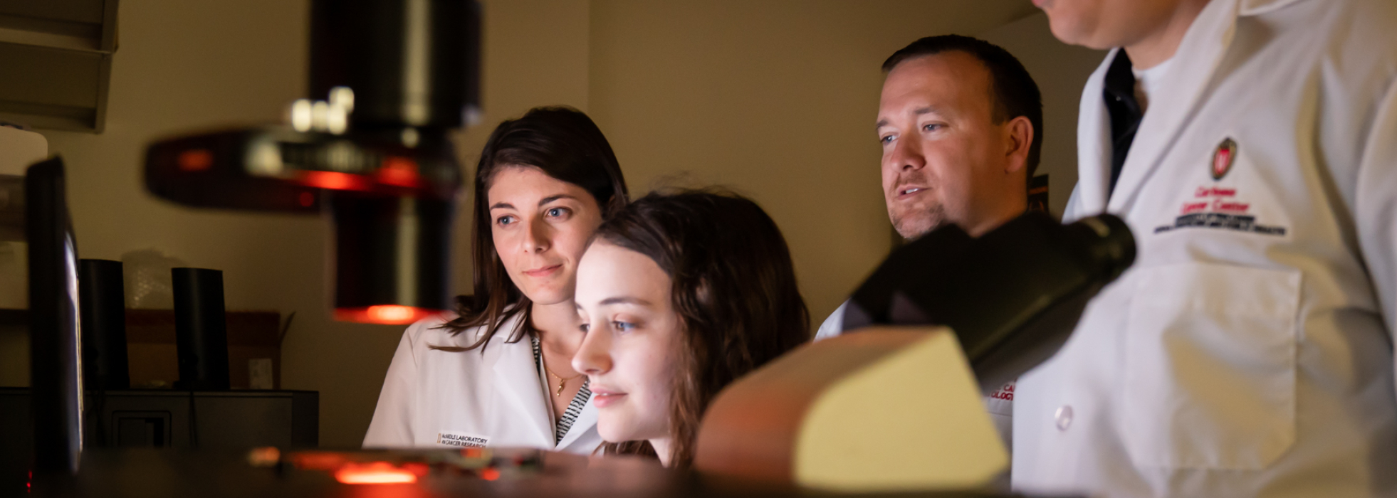  Cancer researchers look at samples in Dr. Dustin Deming's lab