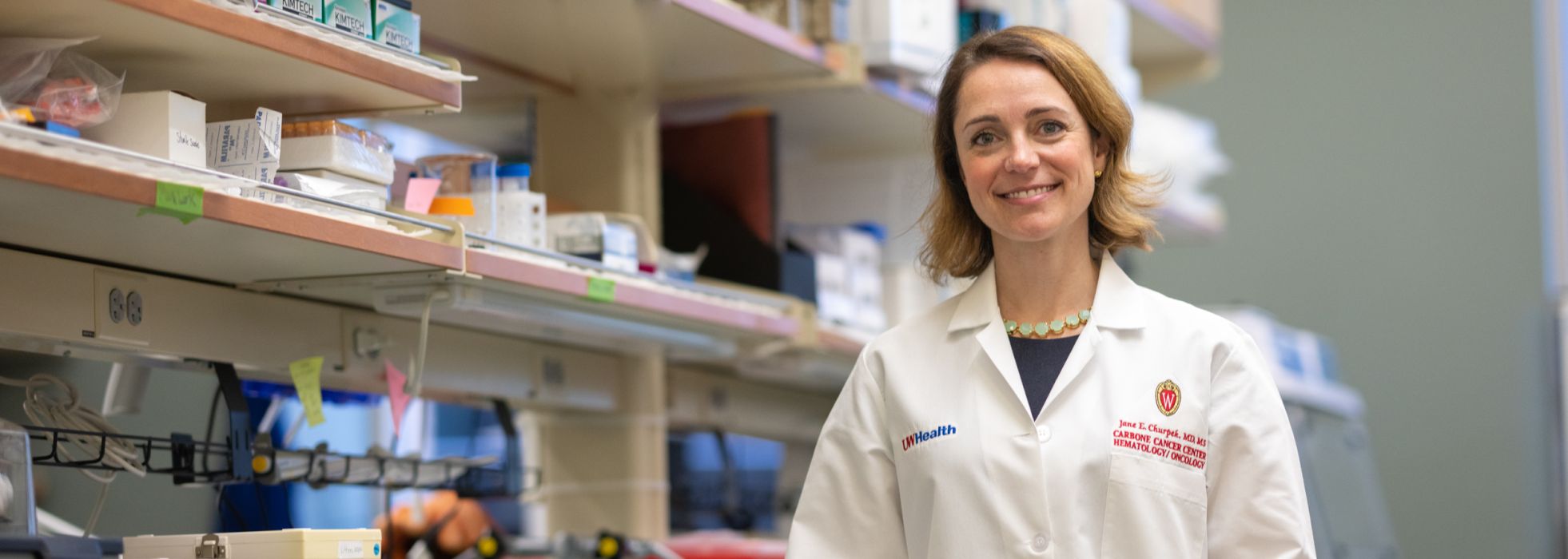 Jane Churpek standing in a lab