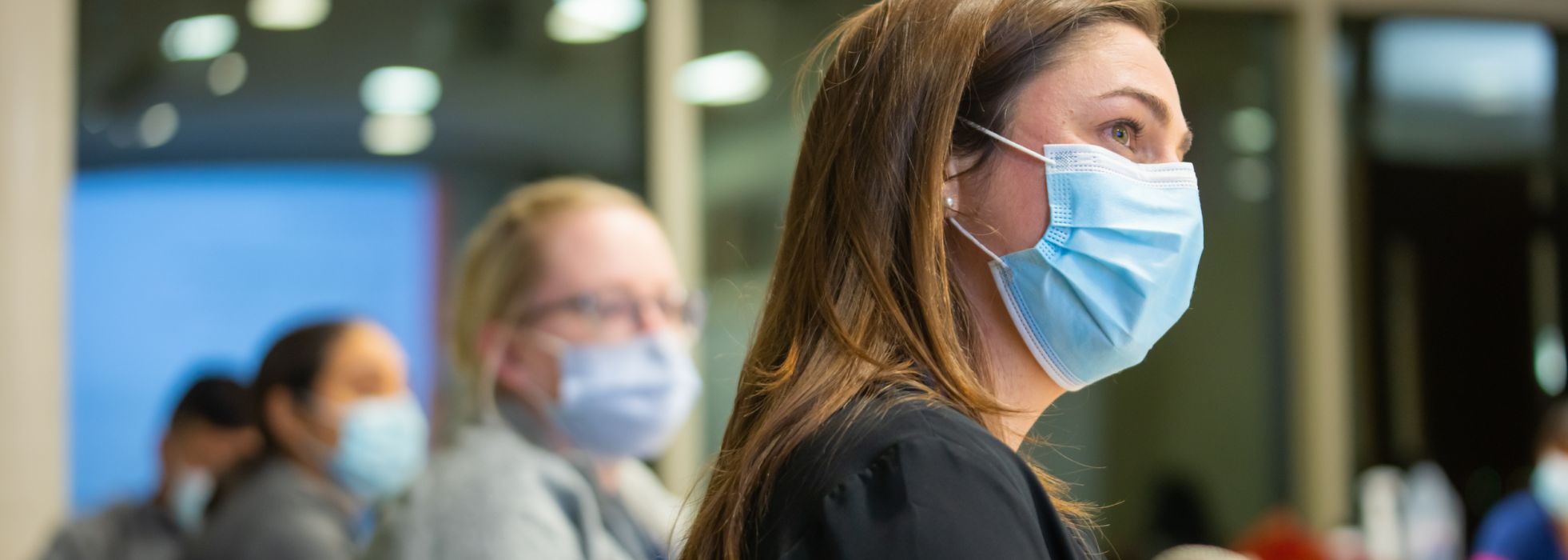 Drs. Sarah Donohue and Dana Ley listen at a WILD session