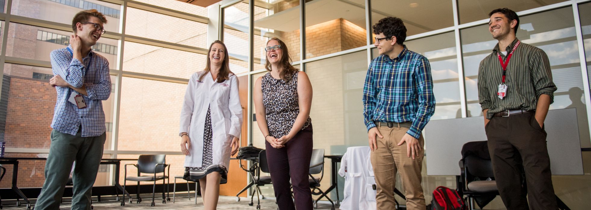 University of Wisconsin internal medicine residents smile and laugh as they participate in a medical improvisation workshop