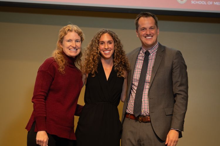 Graduating resident Frankie Garofalo, MD, at center, poses with residency program associate director Kelly Lavin, MD, left, and program director Andy Coyle, MD, right.
