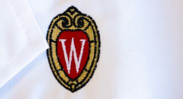 White coat with embroidered UW crest