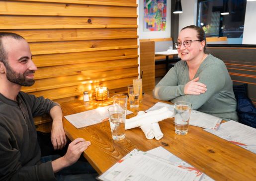 Two department faculty members at a PACSS dinner