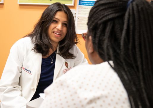 Dr. Sumona Saha talks to a patient in the gastroenterology clinic 