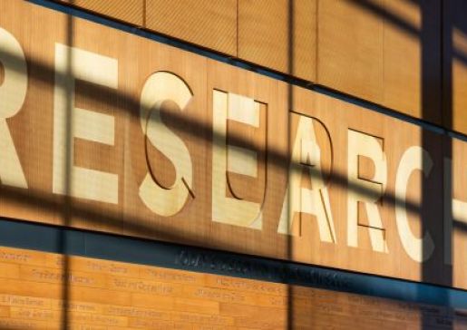 Research signage on a wooden wall