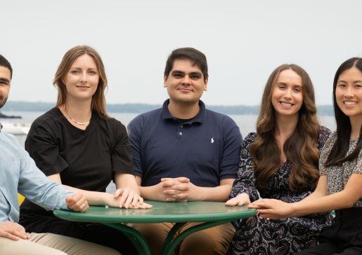 The 2025-26 chief residents sitting at a table outside.