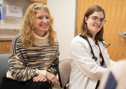 Two women sitting in a clinical room